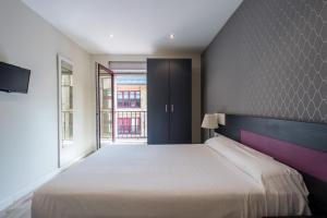 Postel nebo postele na pokoji v ubytování Apartamentos La Albarca