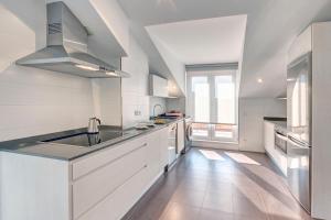 Kuchyň nebo kuchyňský kout v ubytování Apartamentos La Albarca