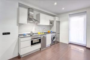 Kuchyň nebo kuchyňský kout v ubytování Apartamentos La Albarca