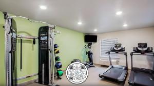 a gym with two tread machines in a room at WoodSpring Suites Libertyville - Chicago in Libertyville