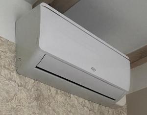 a computer monitor hanging from a ceiling at Old Center Apartment in Liepāja