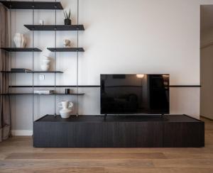 a living room with a table with a vase on it at Aglaya 1 - Luxury 2BR Apartment in Belgrade