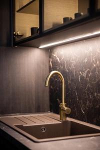 a sink with a faucet in a bathroom at Aglaya 1 - Luxury 2BR Apartment in Belgrade