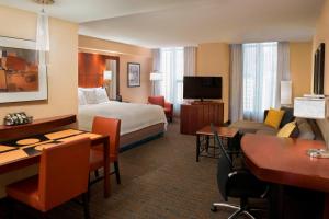 a hotel room with a bed and a desk at Residence Inn by Marriott Toronto Downtown / Entertainment District in Toronto