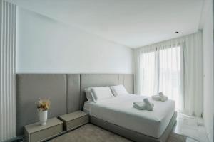 Ένα ή περισσότερα κρεβάτια σε δωμάτιο στο Résidence B Livin - Oasis