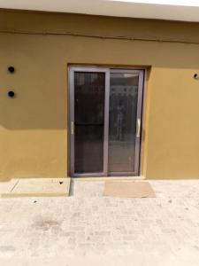 a building with a glass door on the side of it at HOTEL COMFORT in Quelimane