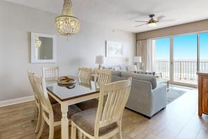 a living room with a table and a couch at Summer Place 505 in Fort Walton Beach