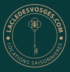 a logo for the montessori nations assurance school at La Charbonnière, grand gîte haut-de-gamme avec jacuzzi et sauna in Gérardmer