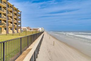 a view of the beach from the balcony of a building at Daytona Beach Resort Studio with Beach Access! in Daytona Beach