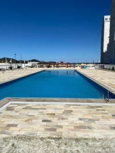 a large blue swimming pool in a building at Resid. Clube Mar Grosso - Laguna - LAG605 in Laguna