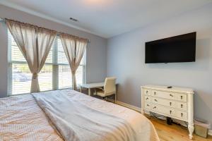 a bedroom with a bed and a desk and a television at Fayetteville Vacation Rental about 24 Mi to Atlanta! in Fayetteville