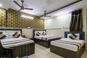 a hotel room with two beds in it at Hotel Preet - Family Hotel in New Delhi