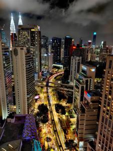 a view of a city at night with traffic at Quill Residences Suites Kuala Lumpur in Kuala Lumpur