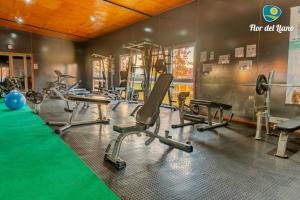 a gym with several treadmills and exercise bikes at Complejo Deportivo y Hotelero Flor del Llano in San Clemente