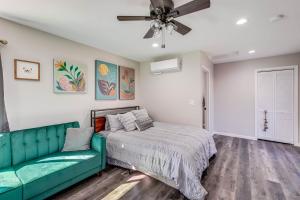 a bedroom with a bed and a couch at Sacramento Studio with Private Yard 4 Mi to Dtwn! in Sacramento