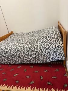 Ліжко або ліжка в номері Modhumita