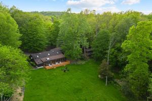 an overhead view of a house in the trees at Large home with indoor heated pool! 
