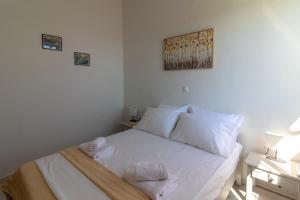 Postel nebo postele na pokoji v ubytování Beachside Apartment-1
