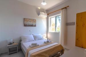 Postel nebo postele na pokoji v ubytování Beachside Apartment-1