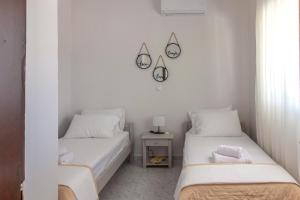 Postel nebo postele na pokoji v ubytování Beachside Apartment-1