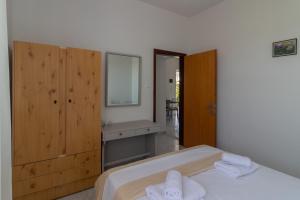 Postel nebo postele na pokoji v ubytování Beachside Apartment-1