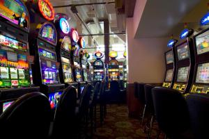 a row of slot machines in a casino at Kwataqnuk Resort & Casino in Polson