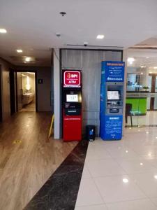 a gas station with two machines in a room at Mactan Cebu Beach Condo in Punta Engaño