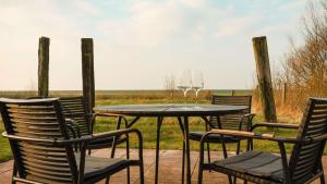 Imagine din galeria proprietății Modernes Holzhaus mit traumhaftem Deichblick în Tümlauer Koog