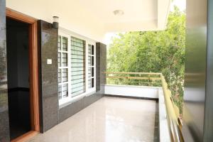 a view from the balcony of a house at ZIONS APERTMENT in Yelahanka