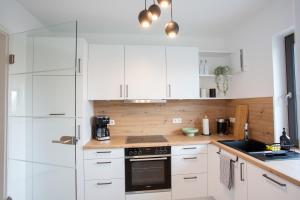 Kuchyň nebo kuchyňský kout v ubytování Siebenschläfer Appartements