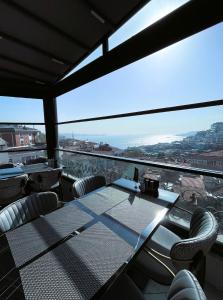 a dining room with a table and chairs with a view at Sing Of Hotel & Suites Taksim Istanbul in Istanbul