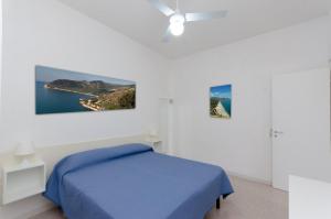 En eller flere senge i et værelse på Villa Lucia