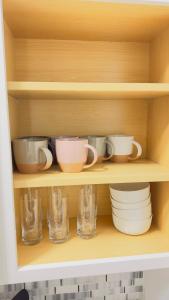 a cupboard with bowls and cups and dishes on it at Studio in Union Square in New York