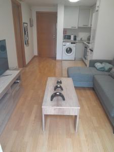 a living room with a couch and a table at IM80 in Montroig