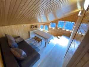 an overhead view of a living room with a couch and a table at Акорди Плеса in Yaremche