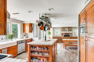 a kitchen with a counter with pots and pans at Escondido Home Private Pool, 2 Grills and Fire Pit! in Escondido