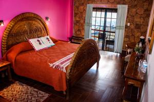 Rúm í herbergi á Hotel Divisadero Barrancas
