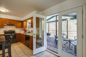a kitchen with a door leading to a dining room at Pet-Friendly Roanoke Home with Fire Pit and Grill! in Roanoke