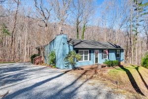 a blue house on the side of a road at Pet-Friendly Roanoke Home with Fire Pit and Grill! in Roanoke