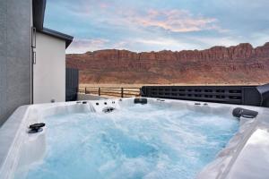 a hot tub with a view of the desert at Vizcaya #1 - Moab's Newest Luxury Rental (Hot Tub) in Moab +7 photos