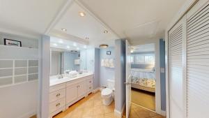 a bathroom with a sink and a toilet and a tub at Lakeside Retreat in Gated Litchfield by the Sea in Pawleys Island