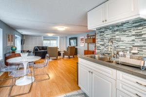 a kitchen and living room with a sink and a table at 7 Mi to Newark Montclair Vacation Rental in Montclair