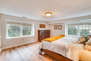 a bedroom with a bed and two windows at 7 Mi to Newark Montclair Vacation Rental in Montclair
