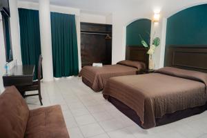 a hotel room with two beds and a couch at Hotel Du Parc in Poza Rica de Hidalgo +8 photos