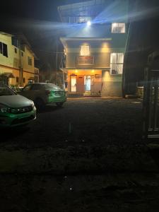 a car parked in front of a building at night at SURYAPRABHA HOLIDAY HOMES in Diveagar