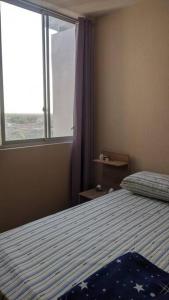 Un pat sau paturi într-o cameră la Apartamento en Piura - Perú