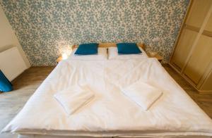 Postel nebo postele na pokoji v ubytování Pension Bella