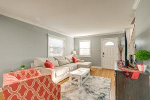 a living room with a couch and a table at Pet-Friendly Alexandria Escape with Yard 8 Mi to DC in Alexandria