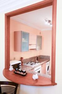 a kitchen with a mirror on a counter at Résidence Palace - Racine in Casablanca