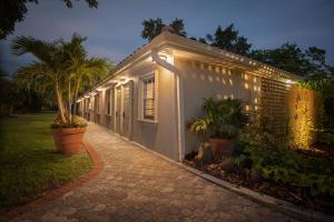 a white building with lights on the side of it at Shangri-La Springs in Bonita Springs